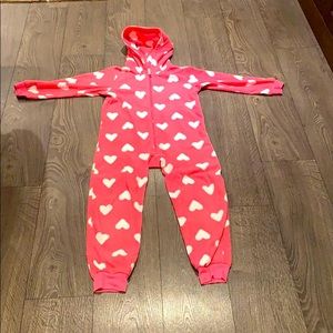 A pink fuzzy heart onesie
